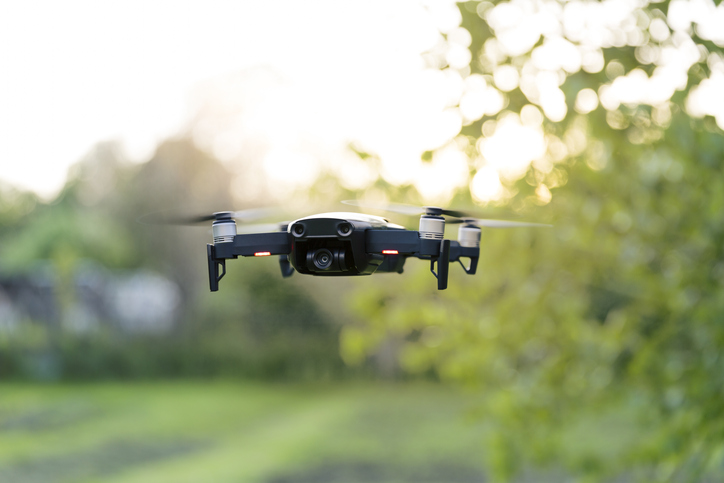 Surveillance drone hovering at eye level with background out of focus