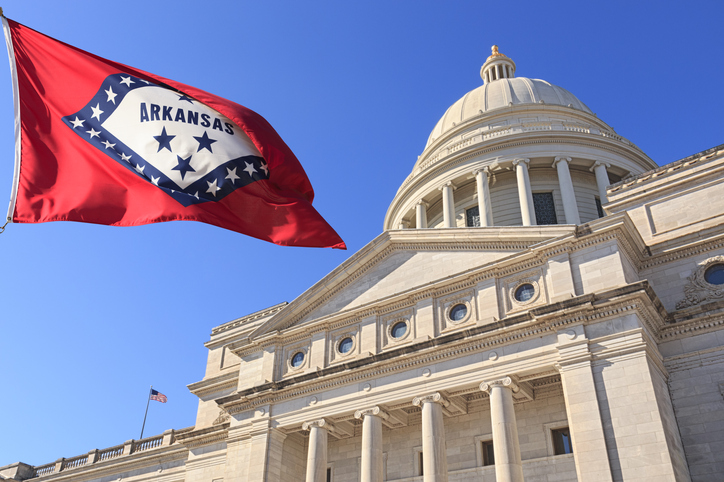 Arkansas flag flying at the State Capitol Building