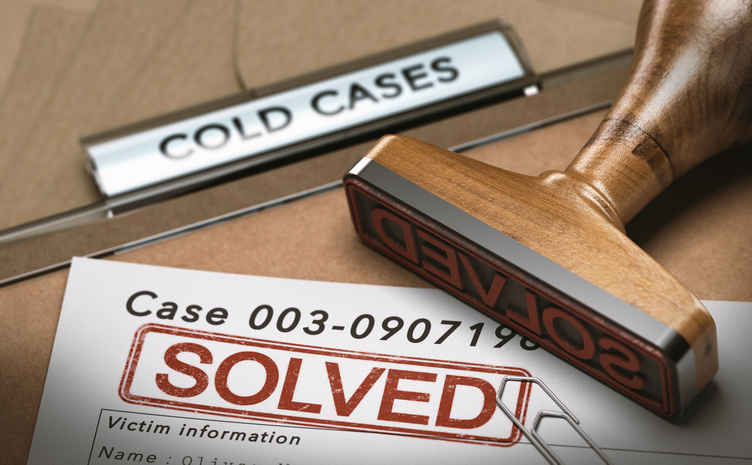 Cold case file stamped "solved" in red
