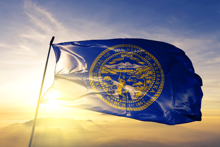 Nebraska state flag at sunset