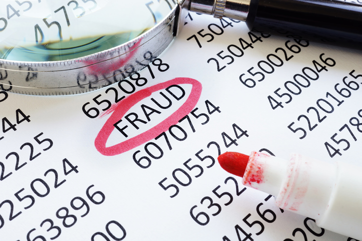 Fraud underlined word and financial data for business audit.